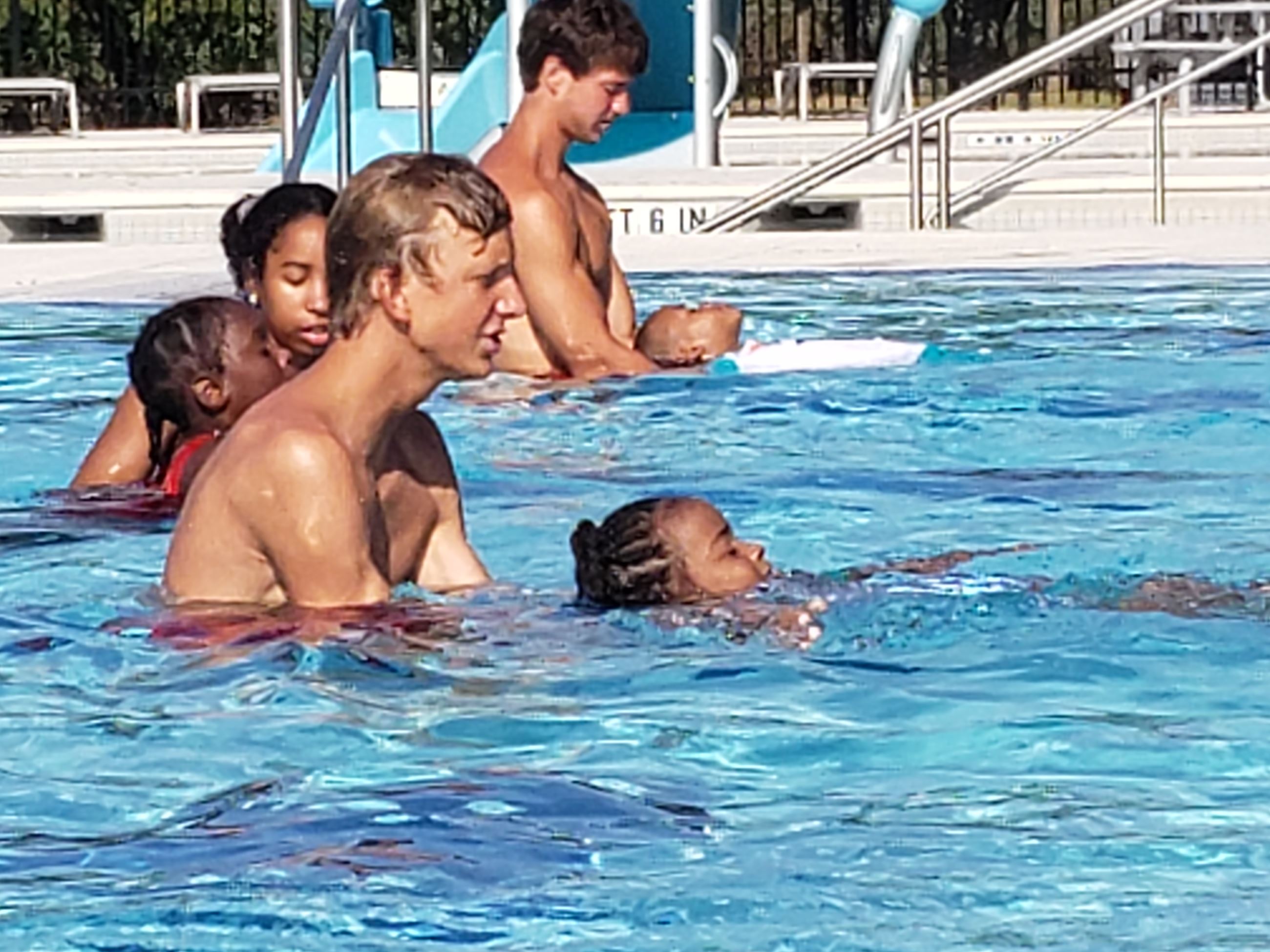 Instructor and child in pool